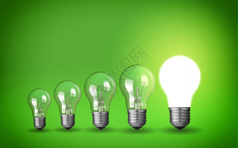 插座灯丝绿色背景的泡创意概念一行灯具支架图片