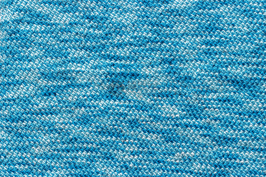 绿松石质地编织有缝线的手工造织物与蓝色纱布捆绑在一起空气图片