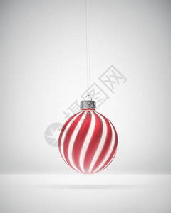 红白装饰球红色的电灯泡马特红白条纹圣诞装饰品挂在白色背景上挥舞着圣诞节的灯光装饰庆气氛概念单身的背景