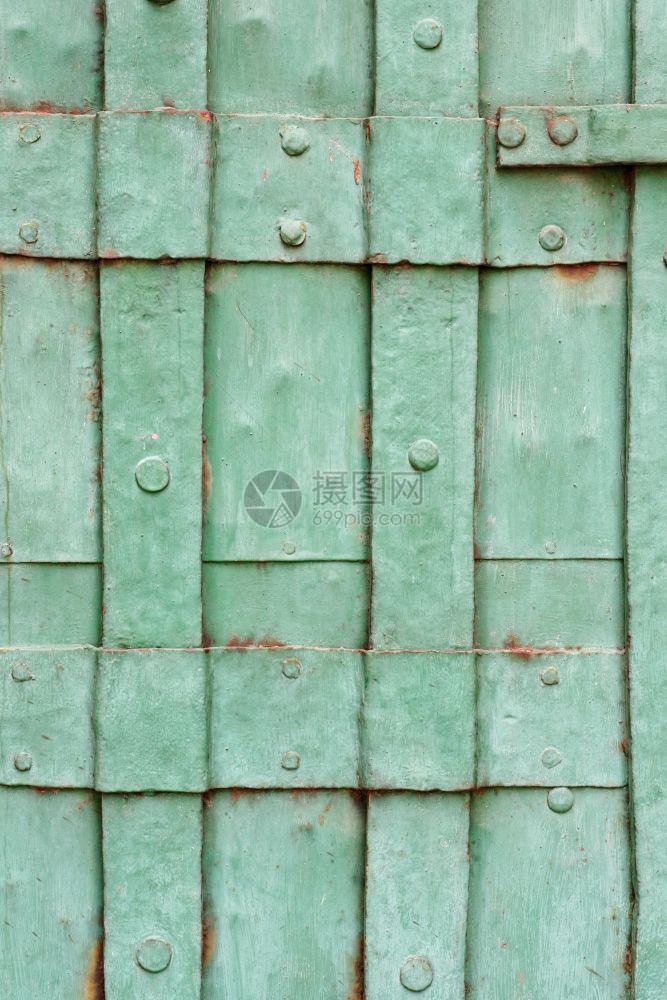 平整度抽象的旧绿漆金属门紧近镜头旧油漆的金属门详细节旧绿色漆的金属门斯克莱兹涅夫图片