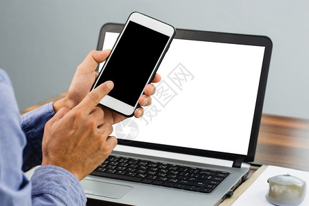 现代的手持智能机模拟屏幕背景技术移动电话手机等闭合式手连接笔记本电脑图片