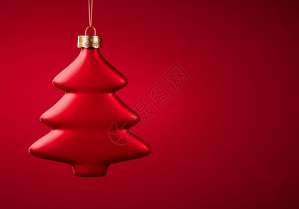 绞刑大气层红圣诞球树形长在绳子上挂布贡迪红色背景的圣诞礼服节庆气氛概念选择焦点复制空间酒红色背景图片