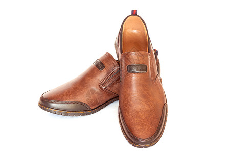 脚丫子半季棕色皮革男鞋隔离在白色背景半季棕皮革男鞋销售目的图片