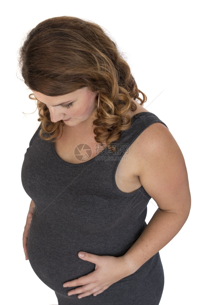 父母健康将手放在肚子上的成年怀孕妇女轻的图片