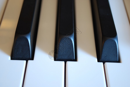 钢琴键前视图的照片爵士乐播放器履行背景图片