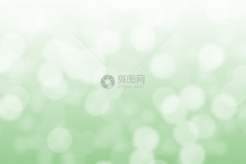 绿色和白bokeh背景的简要光环闪发散焦假期图片