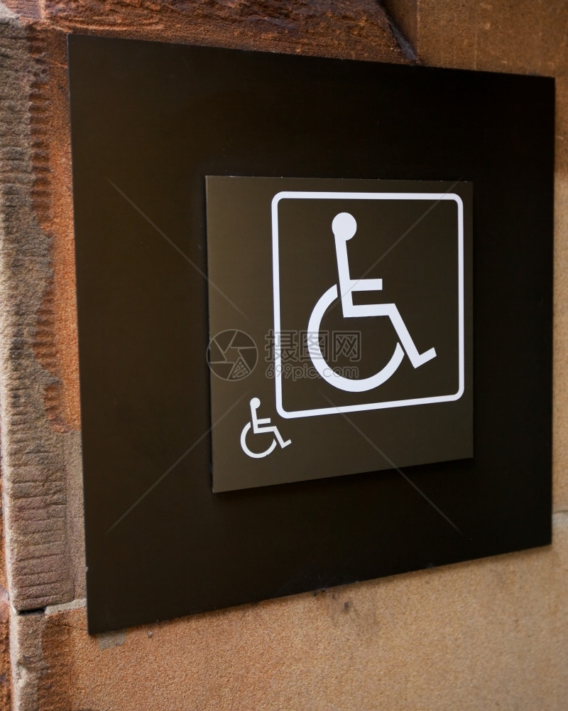扶手椅轮或残疾人手动信号轮椅或大楼上的残疾人标志可访问预订的图片