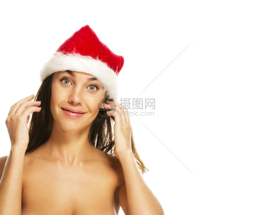 黑发十二月白种人身戴圣塔帽的年轻女子穿着圣塔帽面容笑的年轻女子身着圣塔帽脸在白色背景上笑图片