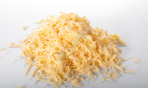 美食桩在白色背景上隔离的干酪关闭黄色的图片