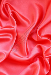 平滑的红丝绸可以用作背景抽象的质地精美图片