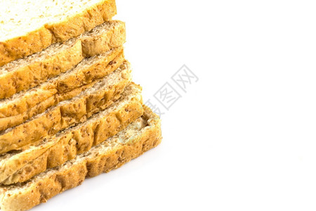 饮食棕色的塔白底全小麦切片面包图片