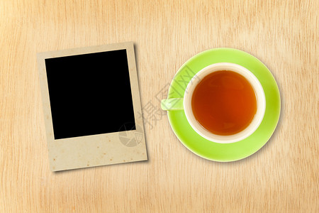 绿色早晨黑的木本底茶和照片框图片