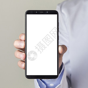 电话打手势用白色屏幕显示智能手机的男医生举并显示白屏幕工作场所图片