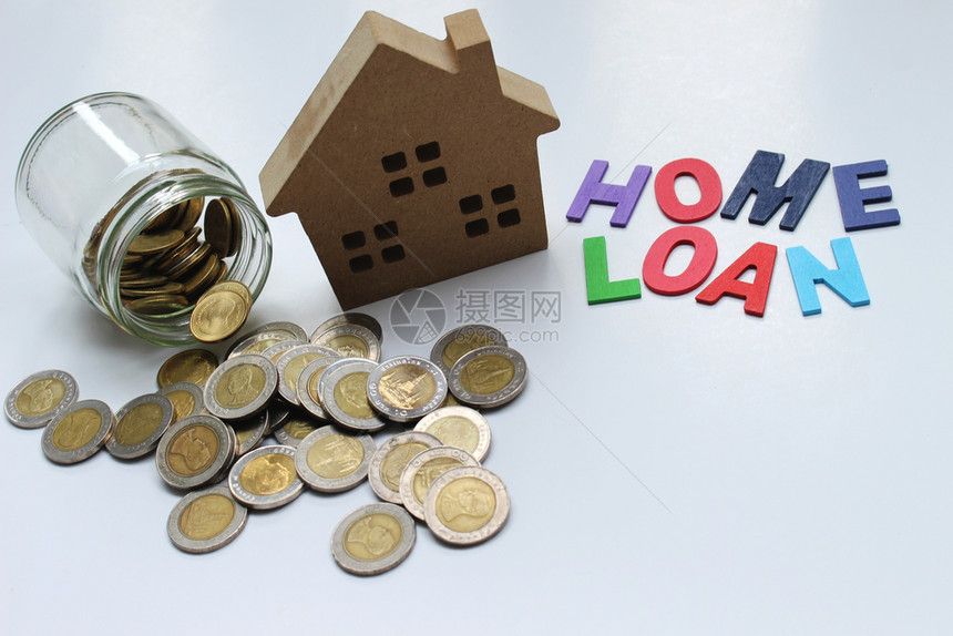 经济家财产HomeLOAN抵押贷款和有复制空间的泰国地产硬币概念图片