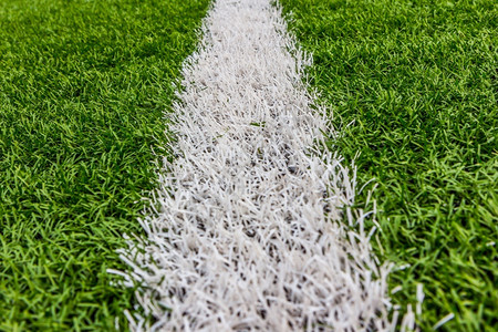 地毯带白条足球体育场的人工草造坪植物建造高清图片素材