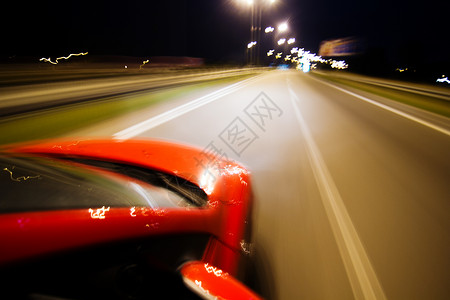 蓝色的高摘要背景模糊红色汽车和许多灯光照亮红色的图片