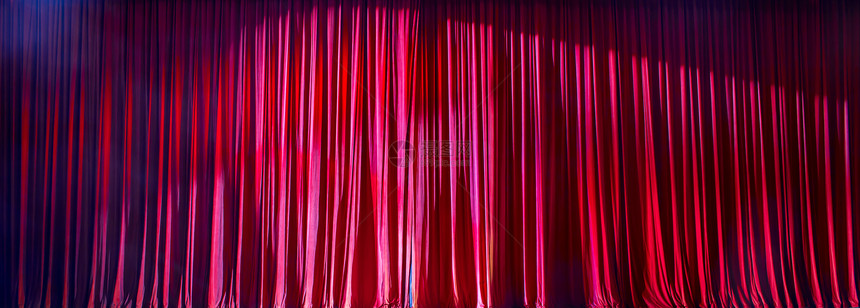 剧院红色窗帘全景灯光照亮一幕黑色的百老汇图片