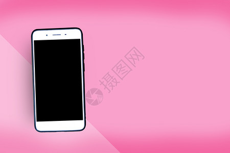 展示粉红背景的智能手机平坦粉色图片