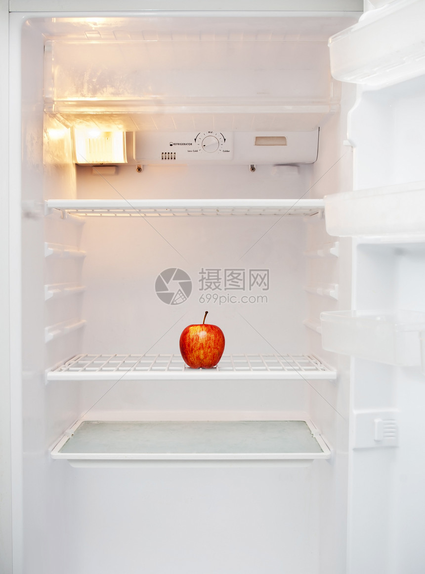 红色的昂贵厨房白色冰箱里面只有一个苹果的白面冰箱图片