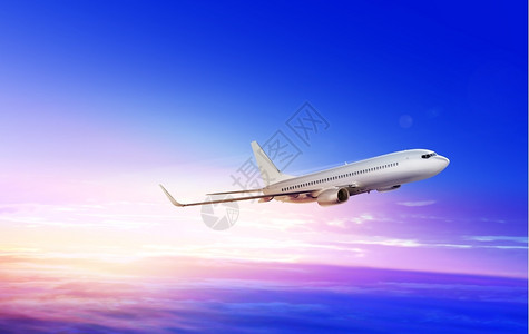 日出时空中飞升的白色客机行航班齿轮图片