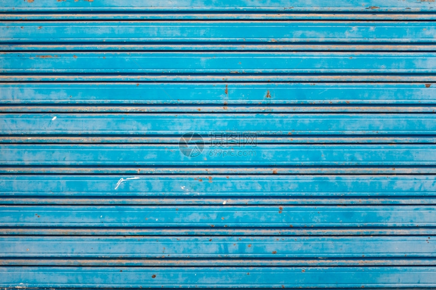旧式和Rusty蓝色滚车轴工业的快门图片