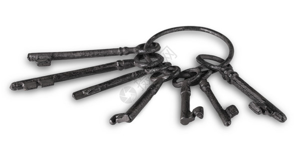 真实的古老钥匙环绑在白色背黑锅上复古的戒指图片