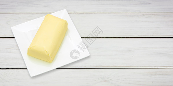 木制白桌板间带天然黄油部分的板块顶视图乳酸传统的有机图片