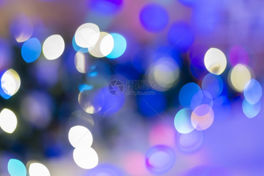 假期BlueFestive优雅的抽象背景带有bokeh灯光和星眨黑色的图片