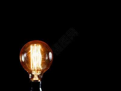 玻璃电灯泡黑色背景上的老式爱迪生灯创意理念复古的白炽灯高清图片素材