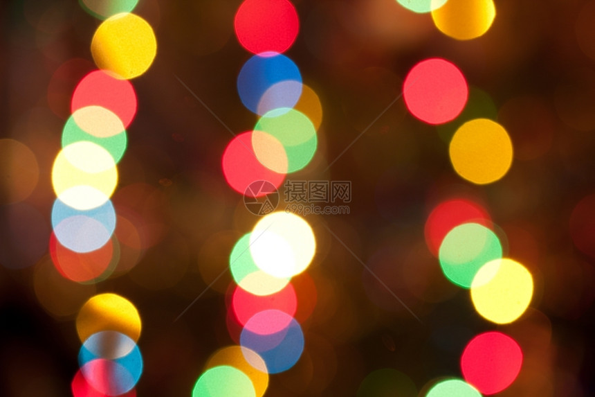 圆圈模糊明亮的色彩多圣诞节灯光抽象背景金的圆形图片