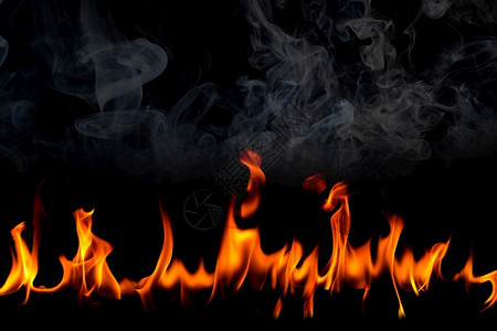 黑底烟雾的火焰燃烧红色热火花上升橙发光的飞粒质地运动壁炉图片