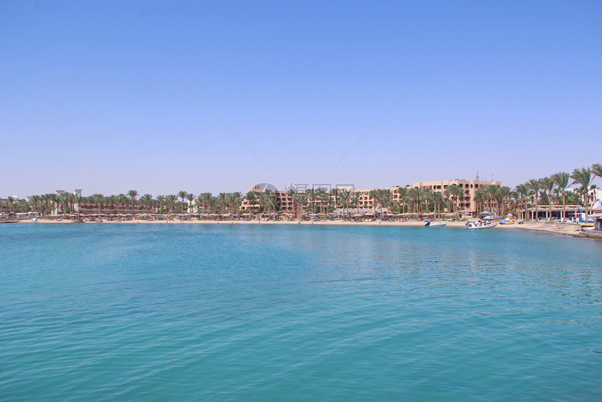 景观夏天埃及的热带度假胜地人们在海中游泳客在海滩上放松人们在红海的滨度假胜地享受期在赫尔格达酒店休息埃及度假胜地的热带度假胜地游图片