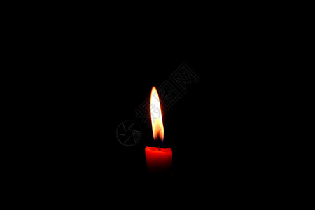 灯芯火黑色的一根光蜡烛在黑色背景上闪亮燃烧图片