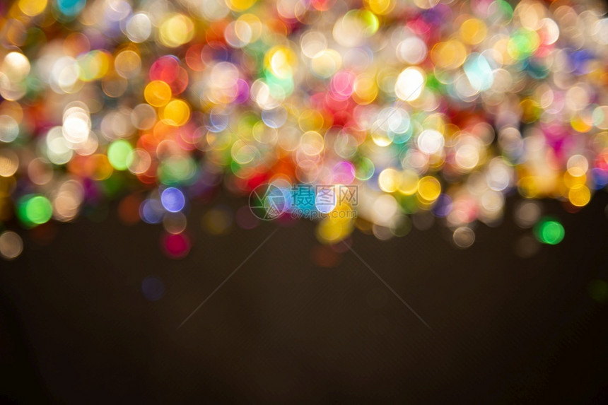 优质的抽象散焦金光彩色亮圣诞节庆背景摘要闪的明光背景与bokeh淡亮的金灯图片