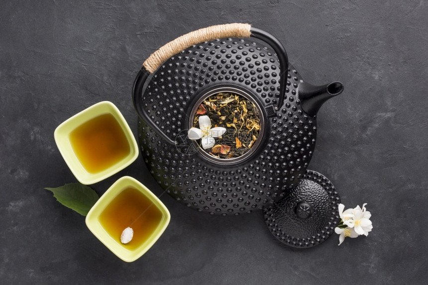 美味健康的草药茶碗黑色壶纸质本底美味的传统节食图片