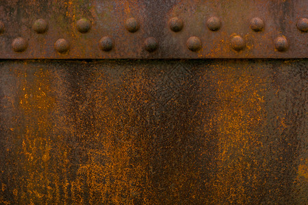 锈铁旧金属生纹理橙垃圾摇滚粗糙的背景图片