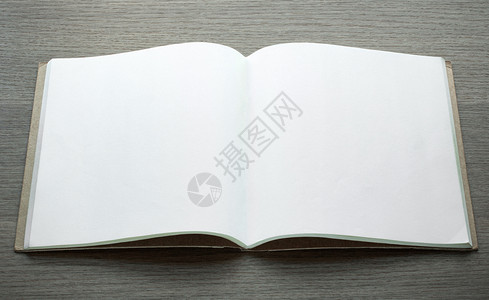 教科书黑木背景的空白打开本写作剪贴簿笔记高清图片素材