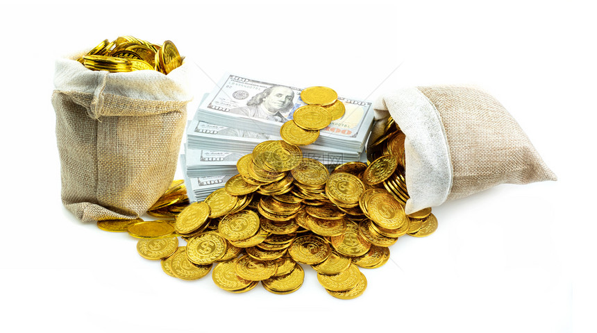 为了桩宝藏10美元钞票和金硬币的堆积袋装在白色背景的宝袋中用于商业规划投资和挽救未来概念的货币堆叠式商业规划投资图片