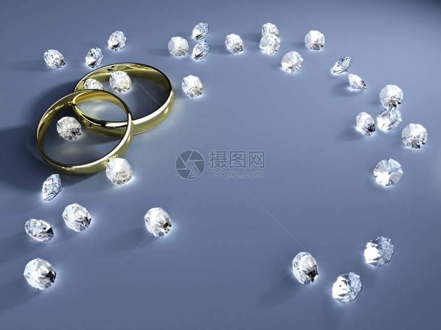 白色的颜婚姻带有金环和钻石的婚礼背景图片
