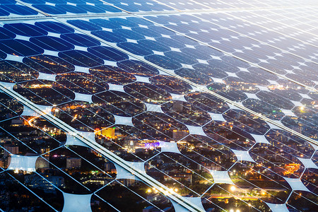 具有城市夜光背景替代能源概念清洁绿色的光伏电池板太阳能的质化面散景全球的背景图片