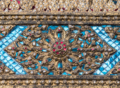 传统的框架泰国风格的古老花朵模式泰国寺庙教堂墙上的蓝色马赛克插图图片