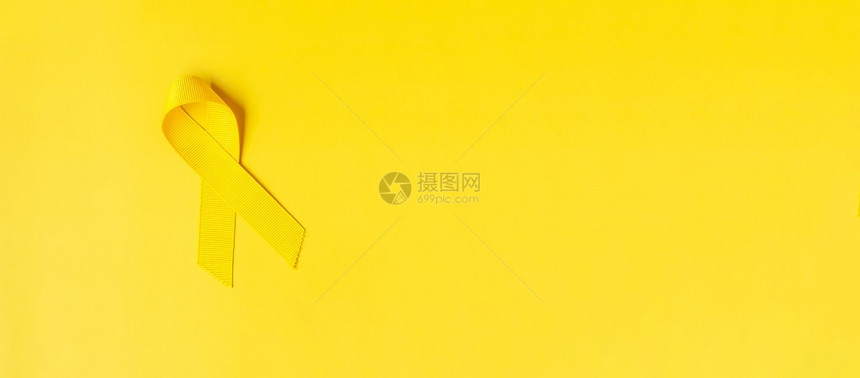 病人黄色背景上的丝带支持人们生活和病9月预防日儿童癌症宣传月和世界癌症日概念意识疾病图片