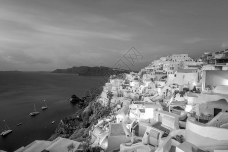 采取蓝色的圣托里尼岛日落的奇观之景著名的欧亚城希腊洲伊亚图片