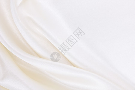 平滑优雅的白色丝绸或席边奢华服装质素可用作婚礼背景和圣诞豪华或新年设计涟漪投标香槟酒背景图片