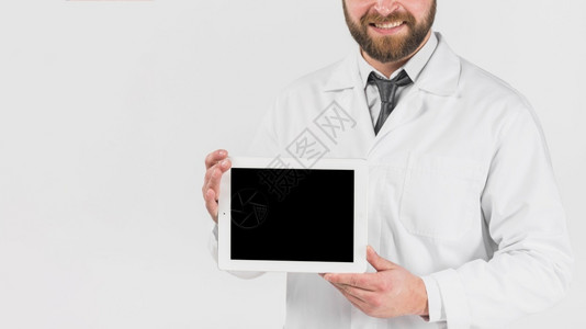 展示平板电脑微笑的医生疾病房间便携的胡须高清图片素材