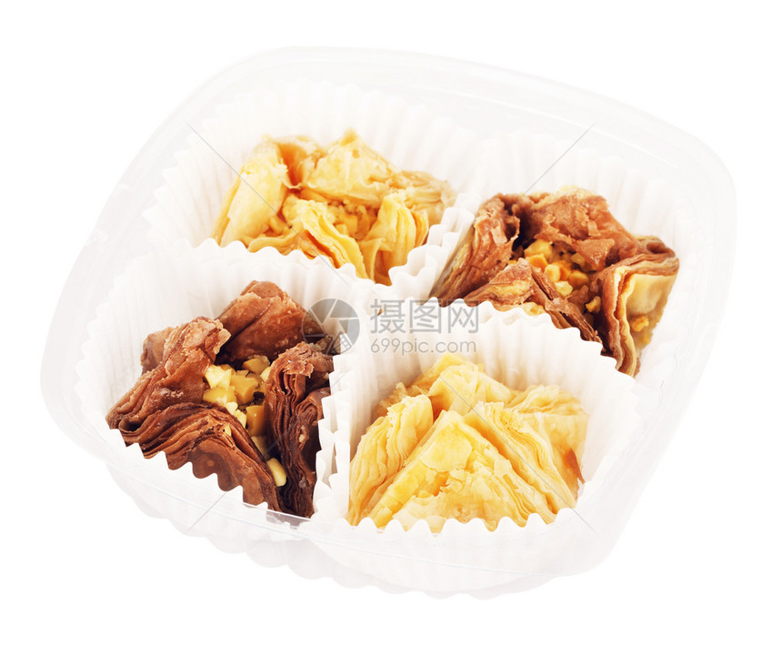 糕点东方的塑料袋中东方甜食baklava在白色背景上被隔离东方甜白拉瓦图片