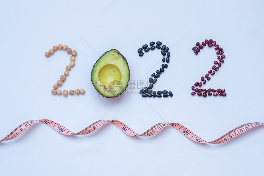 20年新快乐和你有水果蔬菜Avocadoadlay和Bean在会议目标健康动力决议时间到新开端饮食和世界粮日概念上吃卫生保健酮图片