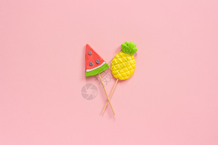 西瓜和菠萝棒棒糖背景图片