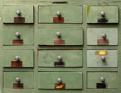 背景和纹理古老的绿木柜子内有抽屉旧的木纸柜子内有抽屉目录陈年质地图片