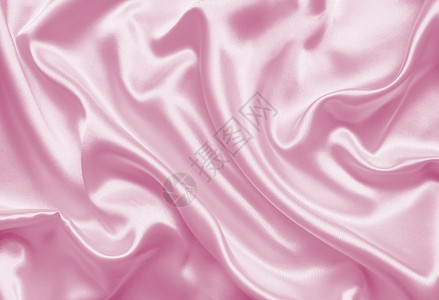 曲线平滑优雅的粉色丝绸或纹质可用作背景缎面天图片